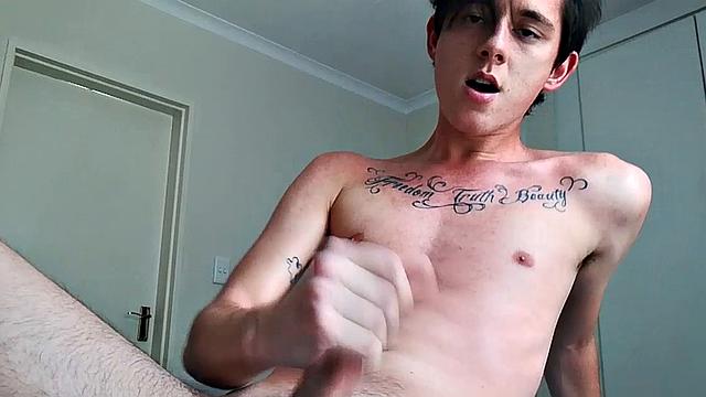 Ant is a slim and smooth twink, with that boy next door look, until the shirt peels off revealing an inked chest. He pushes his shorts down just enough to give us a peek at his fine looking little butt and big uncut cock.