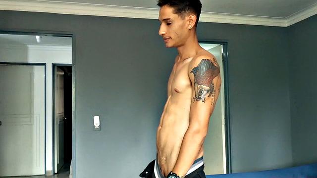 Shirtless Puma opens his pants to expose and gets big cock stiff.
