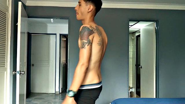 Shirtless Puma opens his pants to expose and gets big cock stiff.