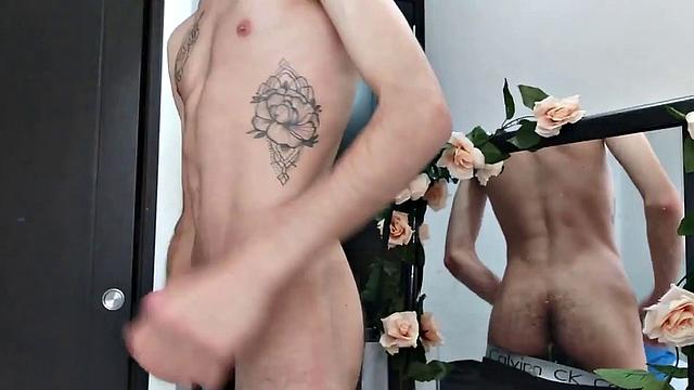 Pervert Boy is back and this time stands as clothes strip off, big uncut cock gets stiff. The skinny young man makes good use of a mirror, jerks off for us.