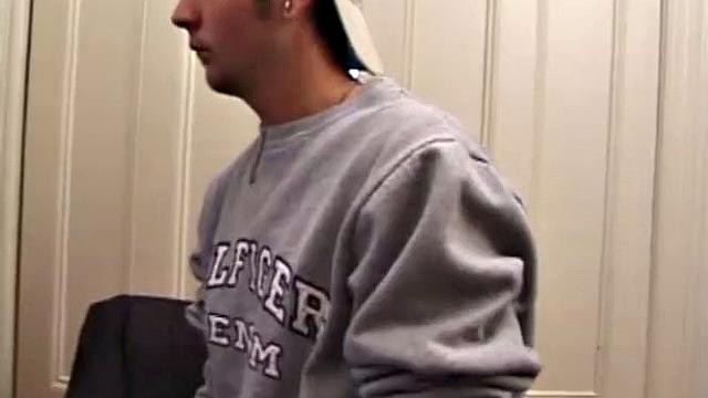 As a porn flick plays, young amateur Aaron Michaels strokes hard, pulls his cock out of his jeans, lets loose, and spills his nut on the bed.