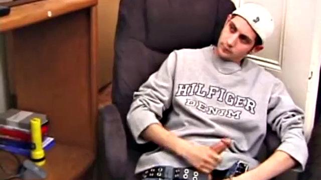 As a porn flick plays, young amateur Aaron Michaels strokes hard, pulls his cock out of his jeans, lets loose, and spills his nut on the bed.
