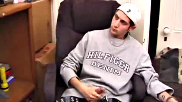 As a porn flick plays, young amateur Aaron Michaels strokes hard, pulls his cock out of his jeans, lets loose, and spills his nut on the bed.