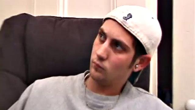 As a porn flick plays, young amateur Aaron Michaels strokes hard, pulls his cock out of his jeans, lets loose, and spills his nut on the bed.