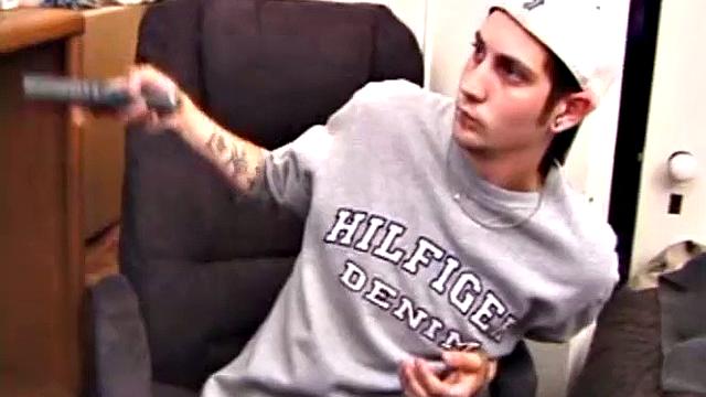 As a porn flick plays, young amateur Aaron Michaels strokes hard, pulls his cock out of his jeans, lets loose, and spills his nut on the bed.