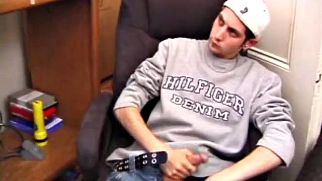 As a porn flick plays, young amateur Aaron Michaels strokes hard, pulls his cock out of his jeans, lets loose, and spills his nut on the bed.