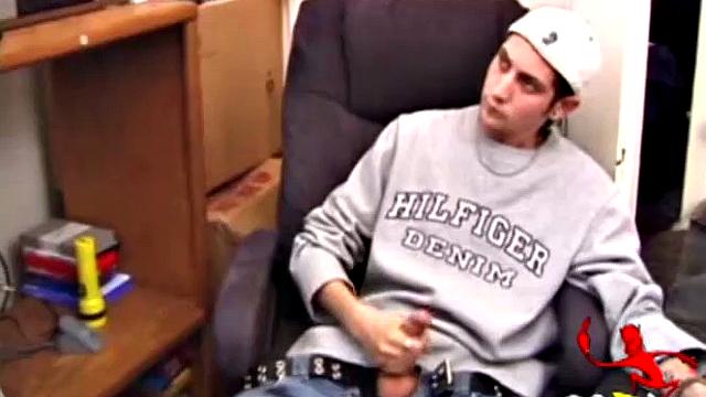 As a porn flick plays, young amateur Aaron Michaels strokes hard, pulls his cock out of his jeans, lets loose, and spills his nut on the bed.