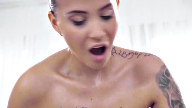 Oiled Ebony lez scissoring with white WAM masseuse on massage