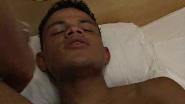 Very hot Latino stud Robert awaits on the bed for Tiago to finish his shower.