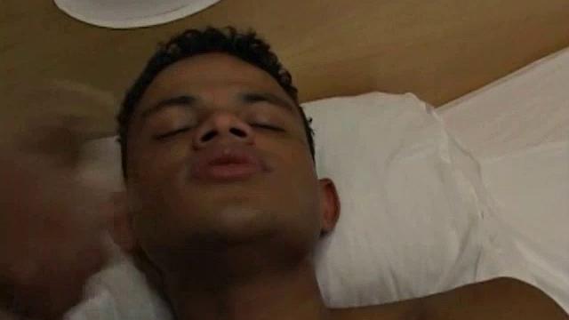 Very hot Latino stud Robert awaits on the bed for Tiago to finish his shower.