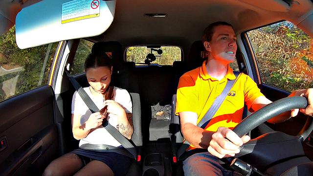 Tattooed brunette fucks for license