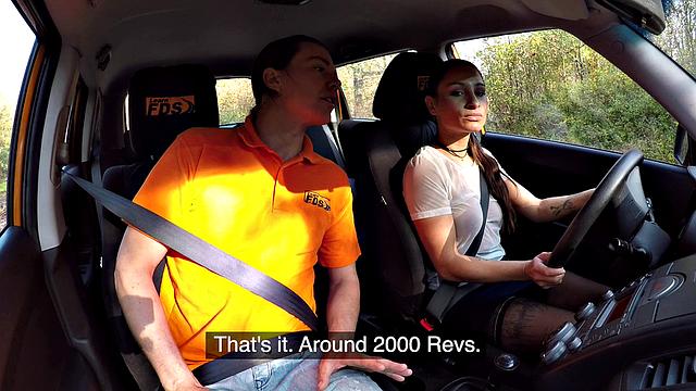 Tattooed brunette fucks for license