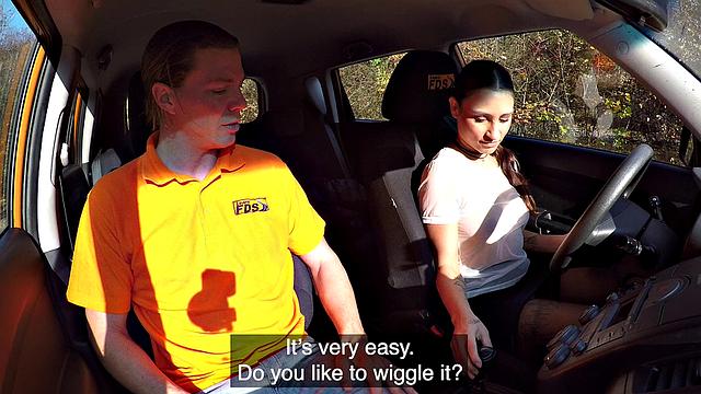 Tattooed brunette fucks for license