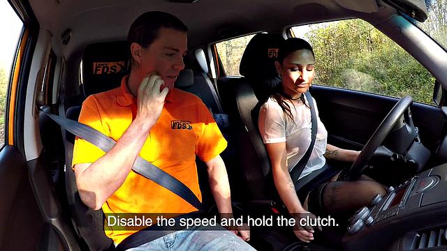 Tattooed brunette fucks for license