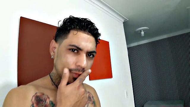 Jhon slowly strips naked, as he works up a stiff one. Once boned up, he sits on a sofa and the long stroke show begins. This horny Latin boy is all over that couch, as he nears climax.