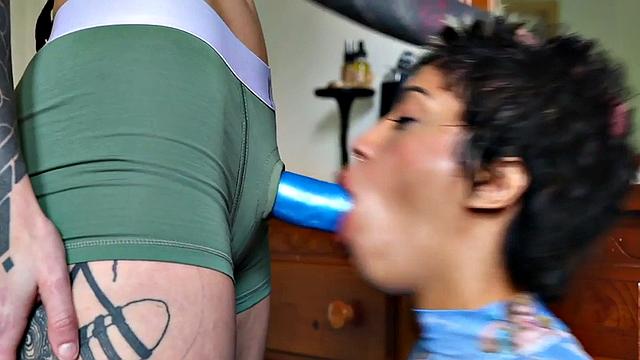 Lesbian inked babe fucks pussy with strapon at home