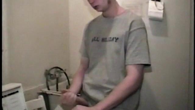 Boy-next-door spreads his new straight porn magazine on top of the washing machine and pulls his cock out of the fly.