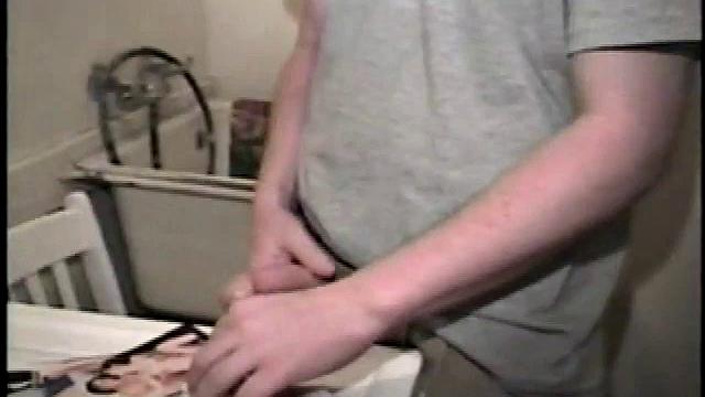 Boy-next-door spreads his new straight porn magazine on top of the washing machine and pulls his cock out of the fly.