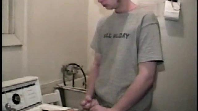 Boy-next-door spreads his new straight porn magazine on top of the washing machine and pulls his cock out of the fly.