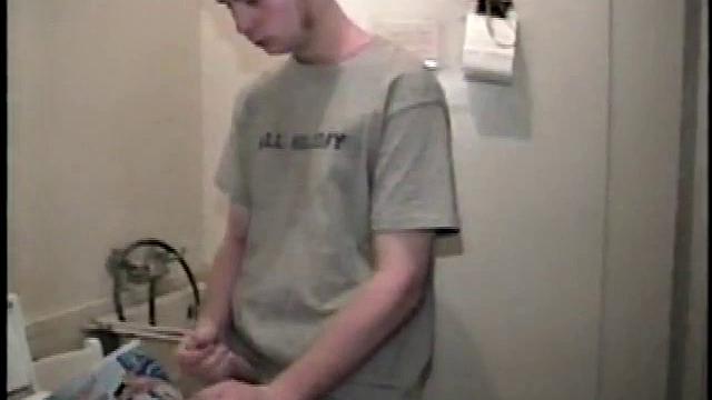 Boy-next-door spreads his new straight porn magazine on top of the washing machine and pulls his cock out of the fly.