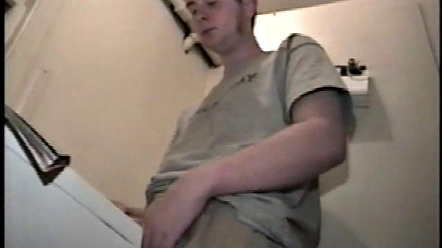 Boy-next-door spreads his new straight porn magazine on top of the washing machine and pulls his cock out of the fly.