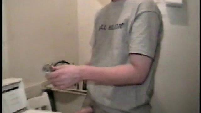 Boy-next-door spreads his new straight porn magazine on top of the washing machine and pulls his cock out of the fly.