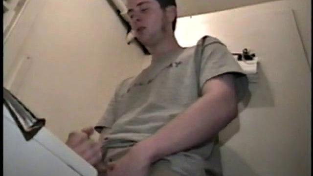 Boy-next-door spreads his new straight porn magazine on top of the washing machine and pulls his cock out of the fly.