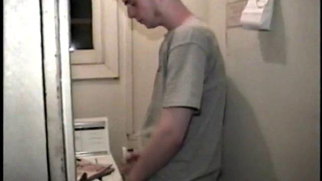 Boy-next-door spreads his new straight porn magazine on top of the washing machine and pulls his cock out of the fly.