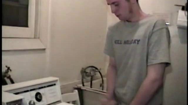 Boy-next-door spreads his new straight porn magazine on top of the washing machine and pulls his cock out of the fly.