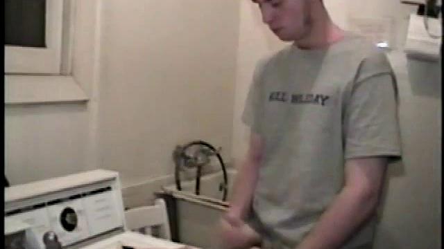 Boy-next-door spreads his new straight porn magazine on top of the washing machine and pulls his cock out of the fly.