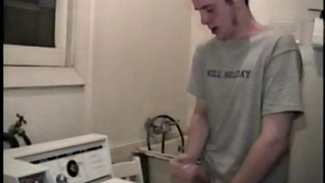 Boy-next-door spreads his new straight porn magazine on top of the washing machine and pulls his cock out of the fly.