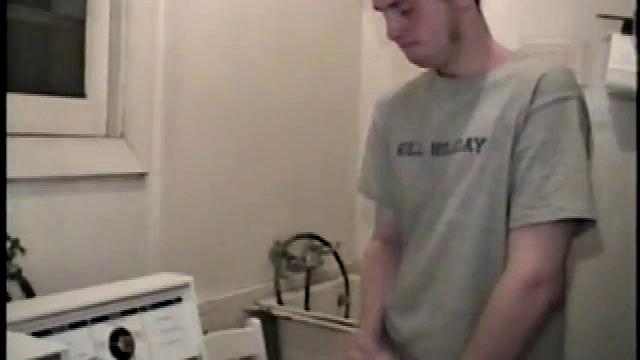 Boy-next-door spreads his new straight porn magazine on top of the washing machine and pulls his cock out of the fly.