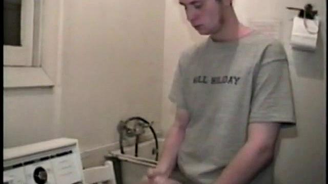 Boy-next-door spreads his new straight porn magazine on top of the washing machine and pulls his cock out of the fly.