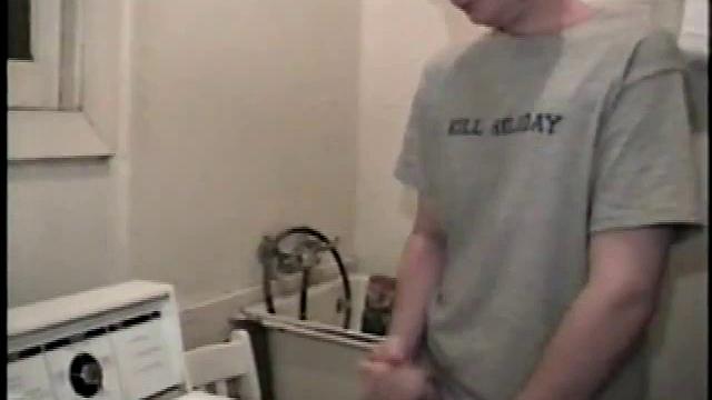 Boy-next-door spreads his new straight porn magazine on top of the washing machine and pulls his cock out of the fly.