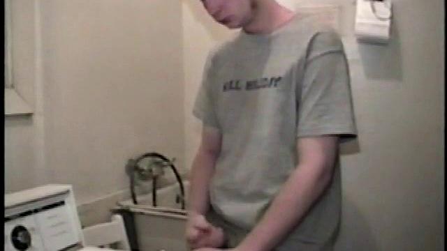 Boy-next-door spreads his new straight porn magazine on top of the washing machine and pulls his cock out of the fly.