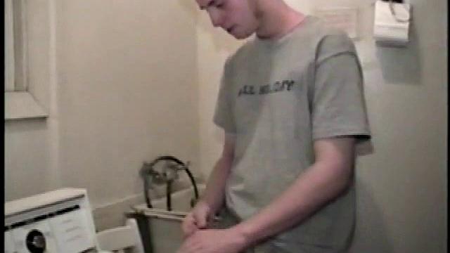 Boy-next-door spreads his new straight porn magazine on top of the washing machine and pulls his cock out of the fly.