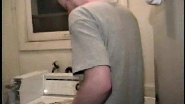 Boy-next-door spreads his new straight porn magazine on top of the washing machine and pulls his cock out of the fly.