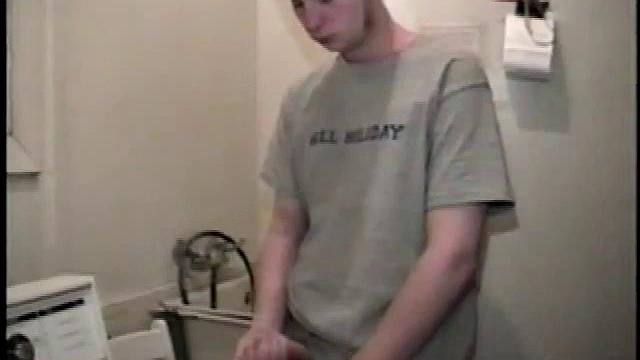 Boy-next-door spreads his new straight porn magazine on top of the washing machine and pulls his cock out of the fly.
