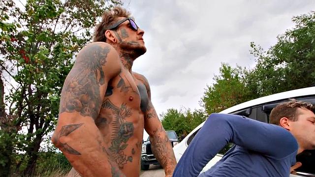 Tattooed gay stud after BJ fucks his BF in the asshole outdoors