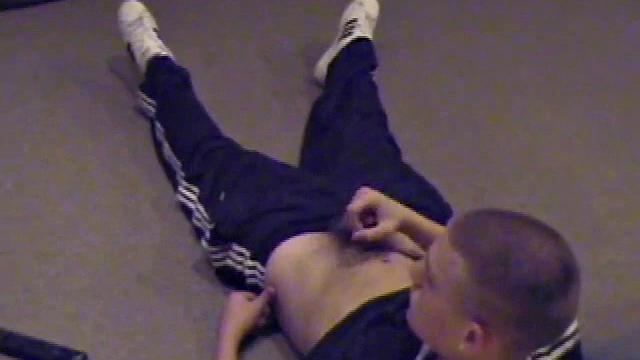 Lance pops in a porn video and pulls out his hard cock. He starts a nice long stroke show, bringing himself close to climax several times. Once past the point of no return, he pumps out a nice warm cum load onto his tummy.