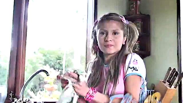 Petite blonde masturbates on the kitchen counter