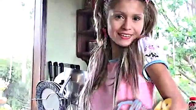 Petite blonde masturbates on the kitchen counter