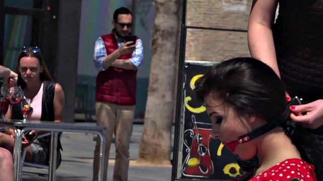 Kinky tattooed brunette sub gagged and humiliated by her domme in public