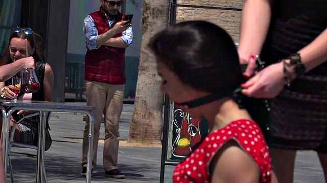 Kinky tattooed brunette sub gagged and humiliated by her domme in public