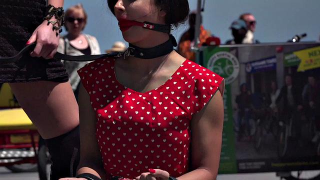 Kinky tattooed brunette sub gagged and humiliated by her domme in public