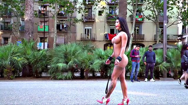 Kinky tattooed brunette sub gagged and humiliated by her domme in public