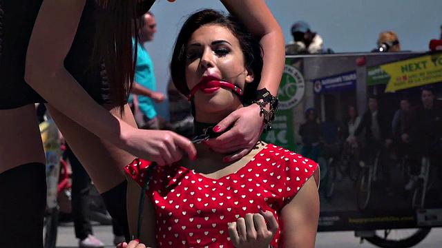 Kinky tattooed brunette sub gagged and humiliated by her domme in public