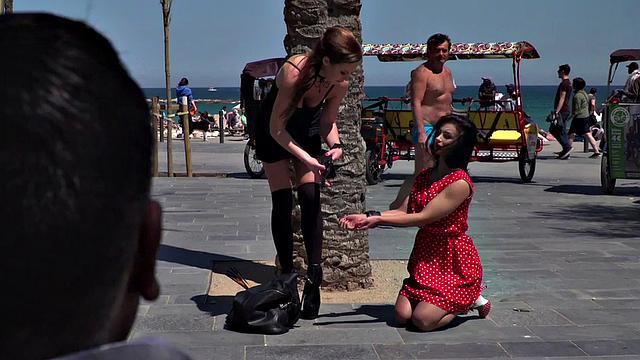 Kinky tattooed brunette sub gagged and humiliated by her domme in public