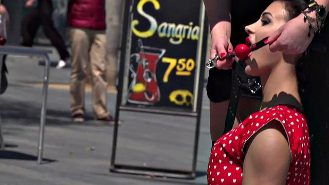 Kinky tattooed brunette sub gagged and humiliated by her domme in public