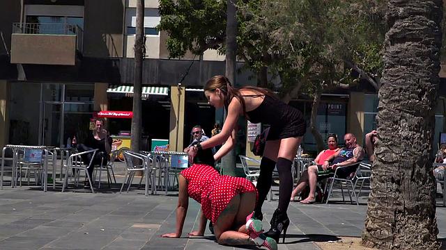 Kinky tattooed brunette sub gagged and humiliated by her domme in public